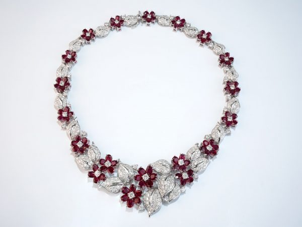 Ruby flower & diamond leaves necklace in white gold